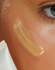 Close-up of a person applying Avocado Zinc sunscreen - SPF 50 Natural Tinted Moisturiser - Light/Medium