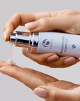 iS Clinical Brightening Complex – cream dispensed onto a fingertip