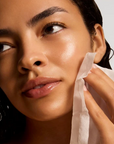 iS Clinical Active Peel System – model using a peel pad on her face