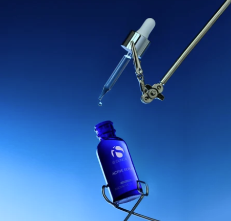 iS Clinical Active Serum – bottle and dropper on blue background