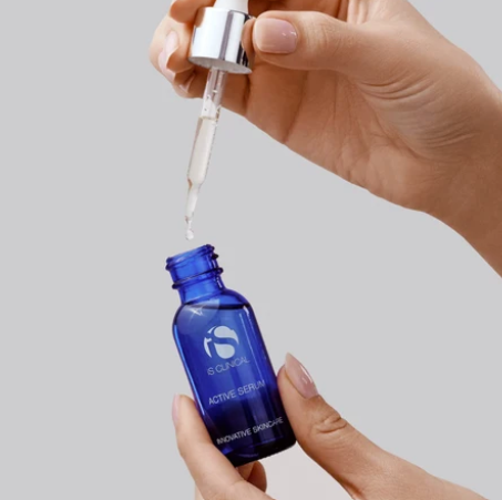 iS Clinical Active Serum – dropper being drawn from the bottle