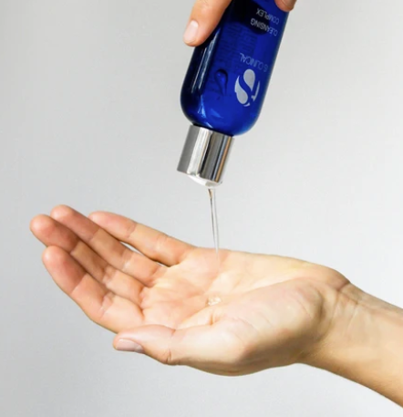 iS Clinical Cleansing Complex – gel poured into a palm