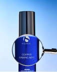 iS Clinical Copper Firming Mist – bottle under a magnifying glass