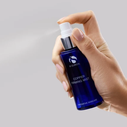 iS Clinical Copper Firming Mist – mist being sprayed