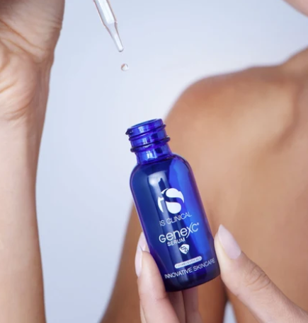 iS Clinical GeneXC Serum – bottle held in hand