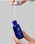 iS Clinical GeneXC Serum – dropper being drawn from the bottle